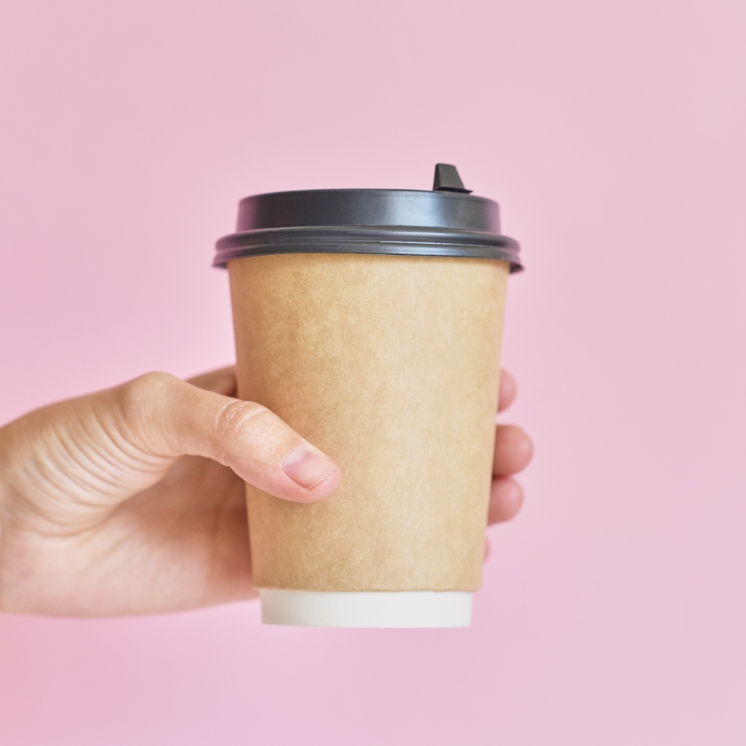 Image of a hand holding a takeaway cup
